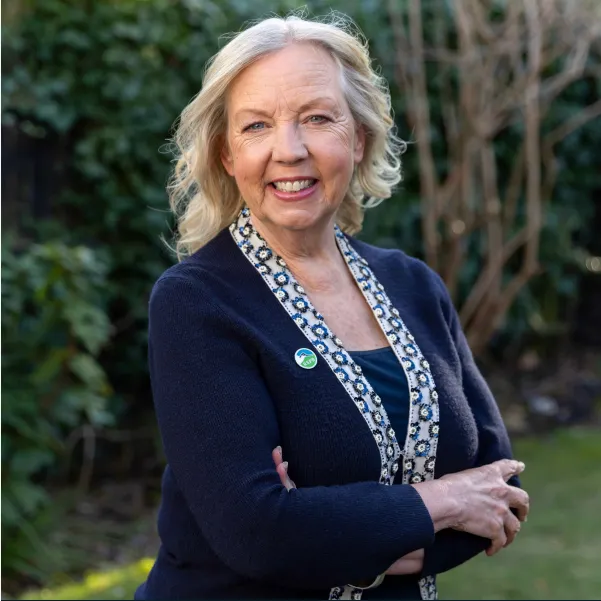 Deborah Meaden smiling whilst wearing an RSPB pin badge.