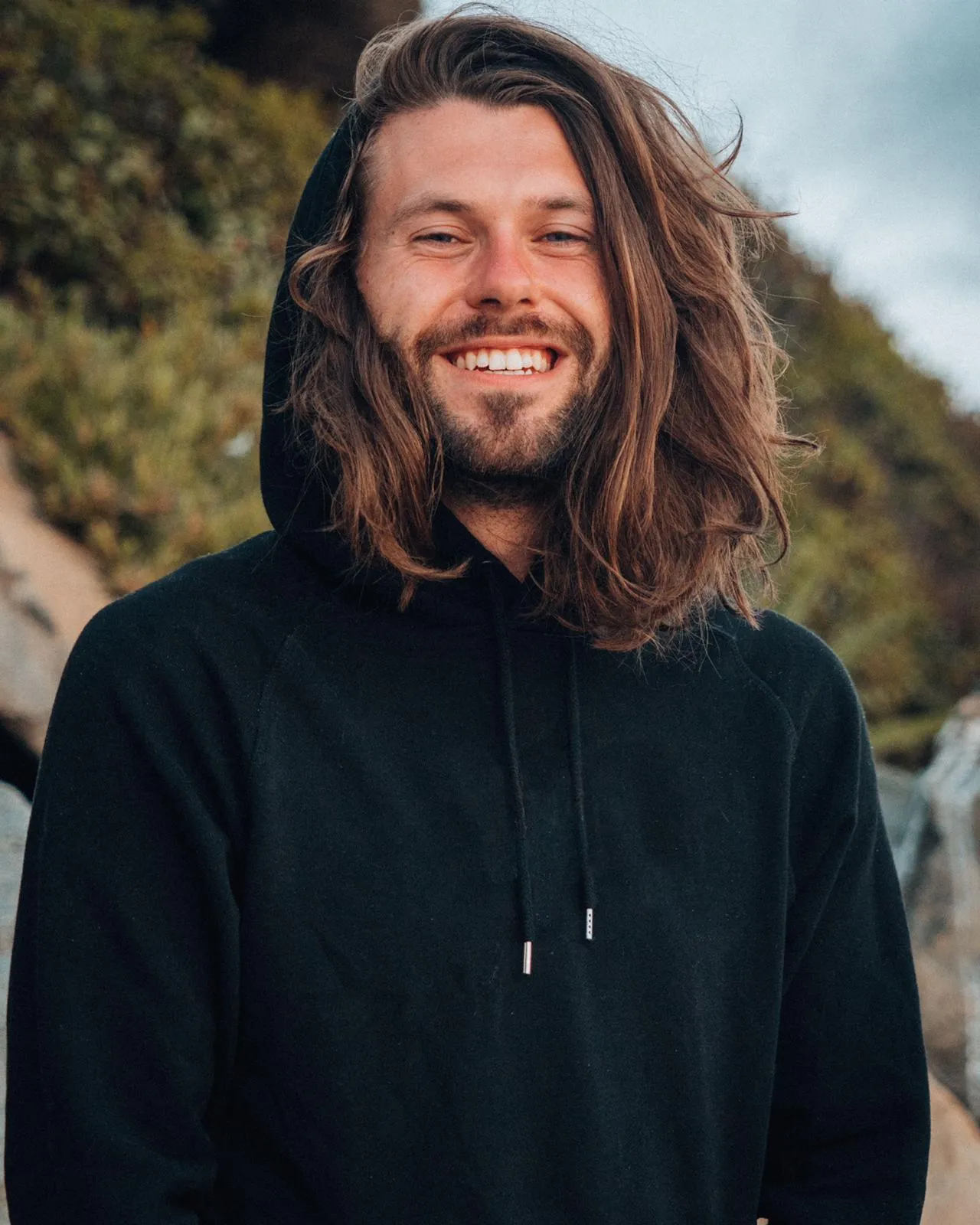 Sam Bentley smiling looking at the camera