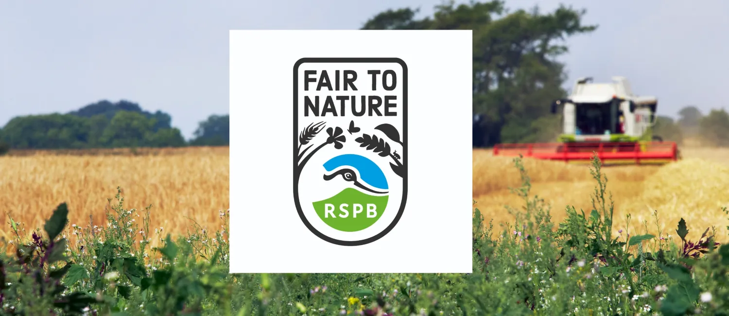 A tractor working on farmland with the RSPB Fair to Nature logo overlayed. 