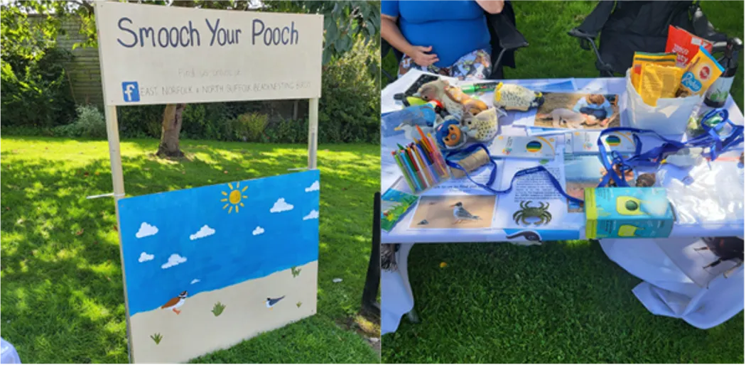 An RSPB volunteer event stand and photo booth called "smooch your pooch" .